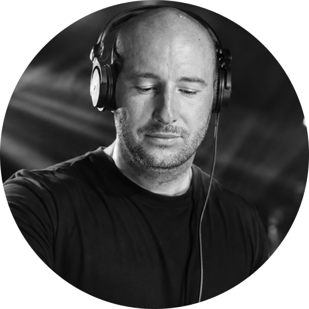 Thierry Ruiz, the composer behind ED3-Studio, wearing headphones in the studio